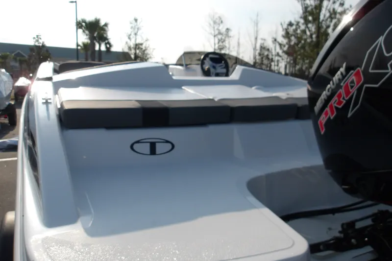 Slide: The Image of 2026 Tahoe T18 boat with Mercury Pro XS engine, parked outdoors. - 20