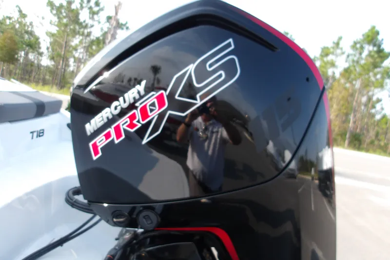 Slide: The Image of Mercury Pro XS engine on 2026 Tahoe T18 boat, outdoors. - 21