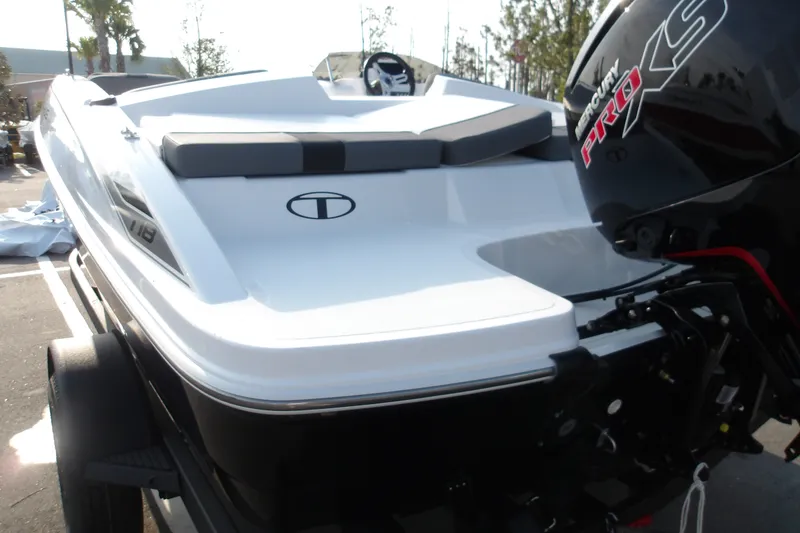 Slide: The Image of 2026 Tahoe T18 boat with Mercury Pro XS engine, parked outdoors. - 7