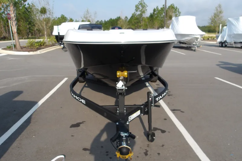 Slide: The Image of 2026 Tahoe T18 boat on trailer in parking lot. - 3