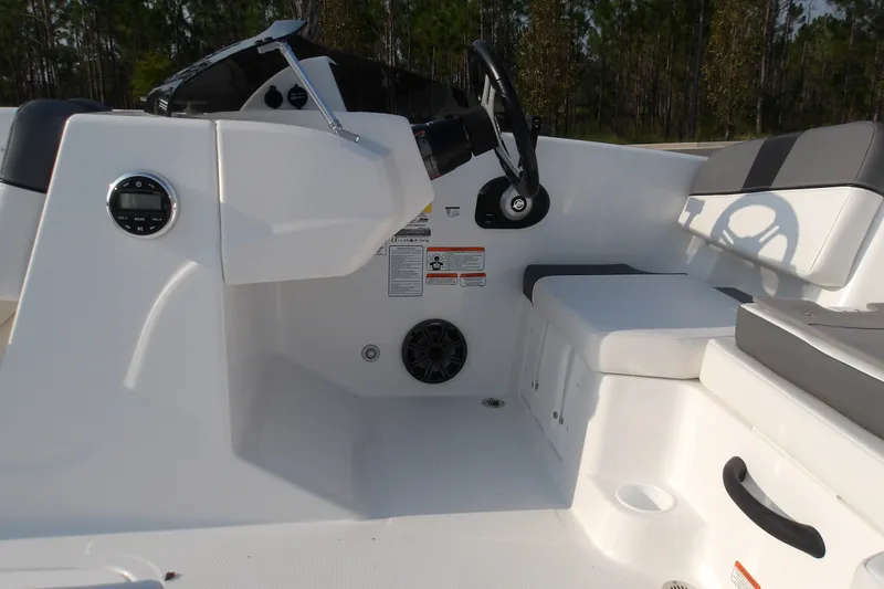 Slide: The Image of 2026 Tahoe T18 boat interior with steering wheel and seating, featuring modern design elements. - 13