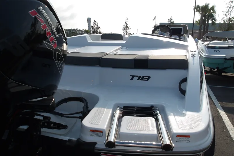 Slide: The Image of 2026 Tahoe T18 boat with Mercury Pro XS engine, docked in a marina. - 19