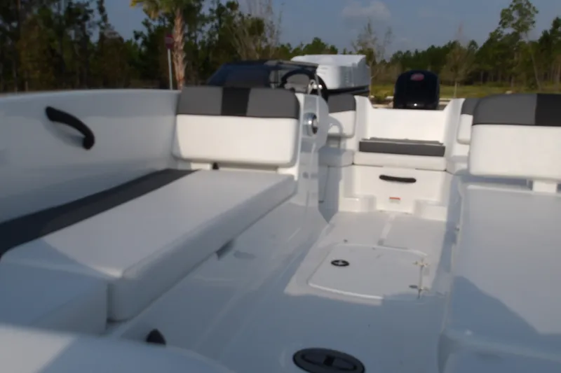 Slide: The Image of 2026 Tahoe T18 boat interior with white seating and storage compartments. - 11