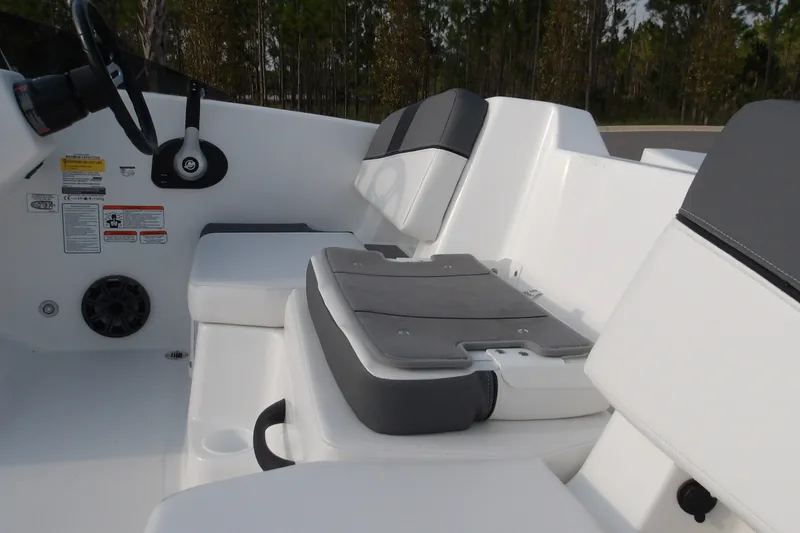 Slide: The Image of Interior view of 2026 Tahoe T18 boat with cushioned seating and steering wheel. - 9
