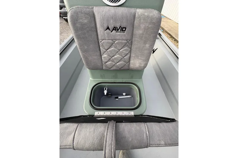 Slide: The Image of Avid 18 Rogue CC 2026 boat interior with open storage compartment. - 10