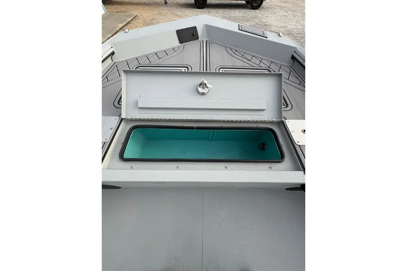 Slide: The Image of Center console of 2026 Avid 18 Rogue CC boat with steering wheel and controls. - 11