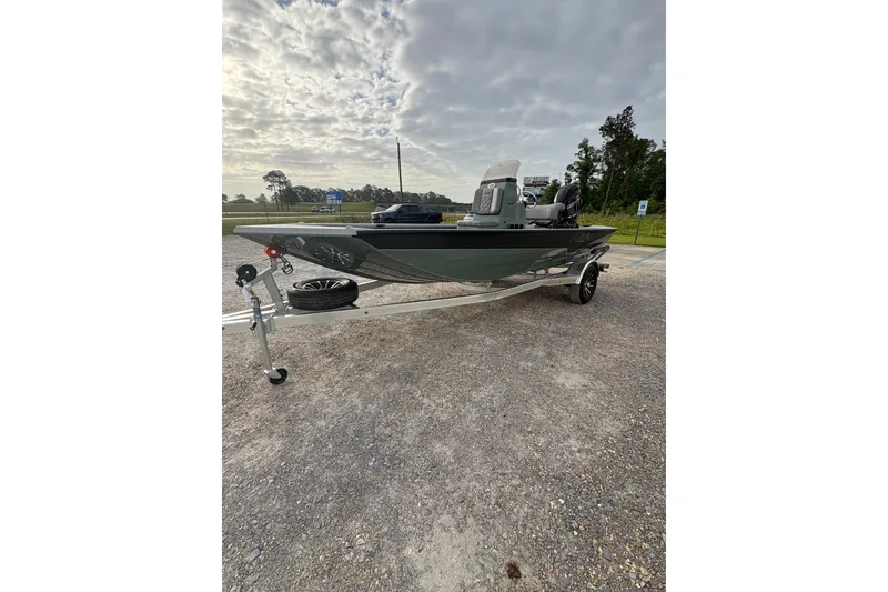 Slide: The Image of 2026 Avid 18 Rogue CC boat with Yamaha motor on a trailer in a sunny outdoor setting. - 3