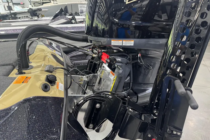 Slide: The Image of 2026 Skeeter ZXE20 boat engine compartment with wiring and components visible. - 10