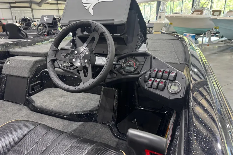 Slide: The Image of 2026 Skeeter ZXE20 boat cockpit with steering wheel and control panel. - 14