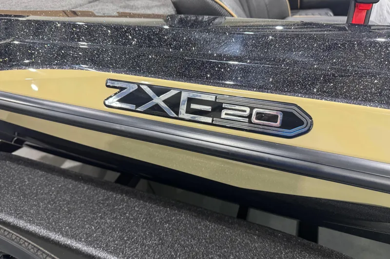 Slide: The Image of 2026 Skeeter ZXE20 boat model emblem with sparkling black and beige finish. - 2