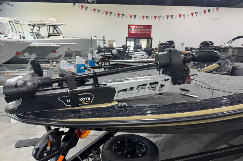 Slide: The Image of 2026 Skeeter ZXE20 boat with Minn Kota Ultrex trolling motor in showroom. - 5