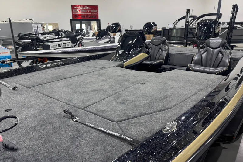 Slide: The Image of 2026 Skeeter ZXE20 boat with spacious deck and sleek seating in showroom. - 7