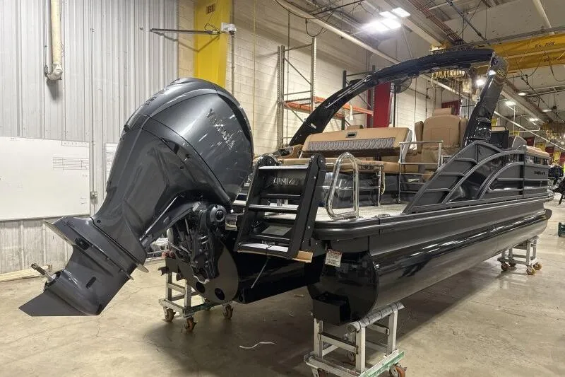 Slide: The Image of 2026 Bennington R 23 RSBA pontoon boat in a workshop setting. - 3