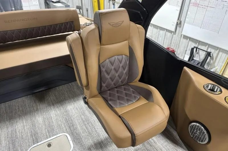Slide: The Image of Luxurious seating in 2026 Bennington R 23 RSBA boat, featuring elegant brown upholstery. - 5