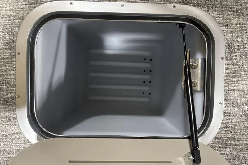 Slide: The Image of Storage compartment of 2026 Bennington R 23 RSBA boat, featuring a hydraulic lift. - 6