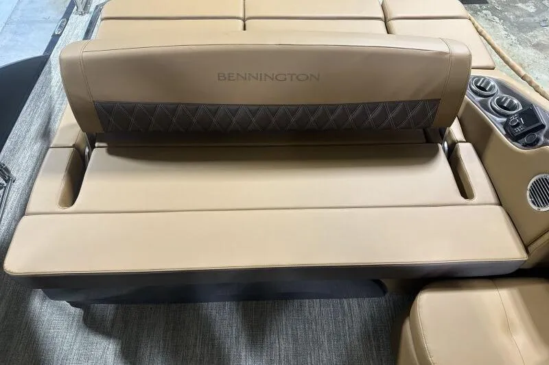 Slide: The Image of 2026 Bennington R 23 RSBA boat interior with tan leather seating and cup holders. - 9
