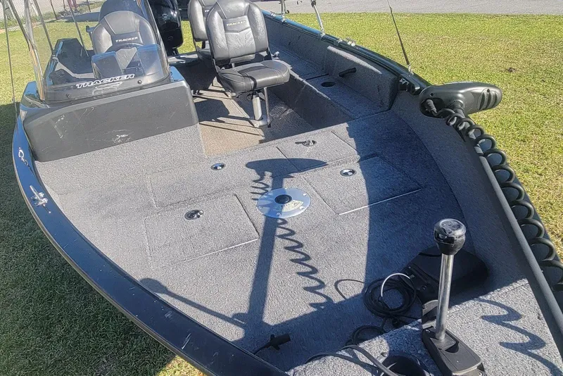 Slide: The Image of 2020 Tracker Pro Guide V-16 SC boat interior with seating and controls. - 12