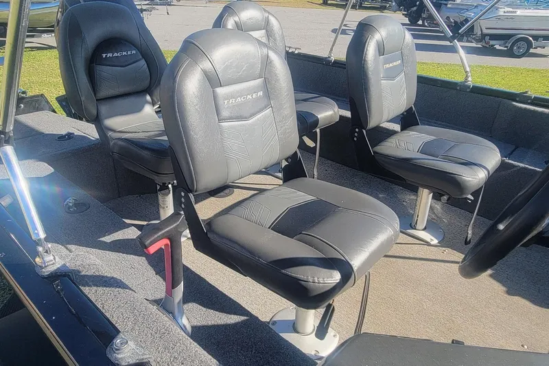 Slide: The Image of 2020 Tracker Pro Guide V-16 SC boat interior with four cushioned seats. - 13