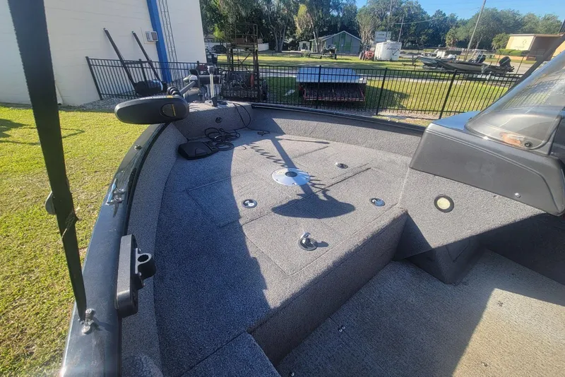 Slide: The Image of 2020 Tracker Pro Guide V-16 SC boat interior with fishing deck and controls. - 14