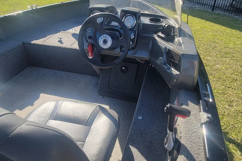 Slide: The Image of 2020 Tracker Pro Guide V-16 SC boat interior with steering wheel and dashboard. - 17