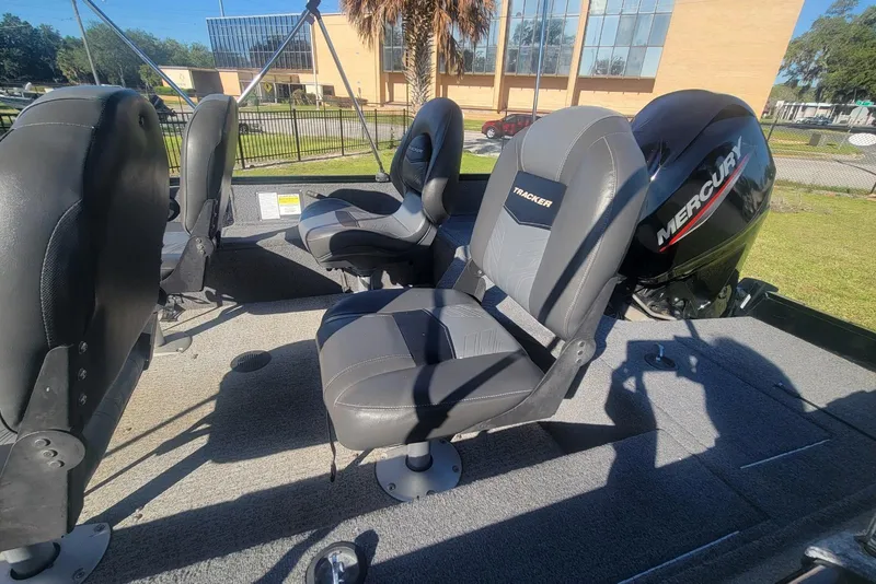 Slide: The Image of 2020 Tracker Pro Guide V-16 SC boat interior with Mercury engine and seating. - 9