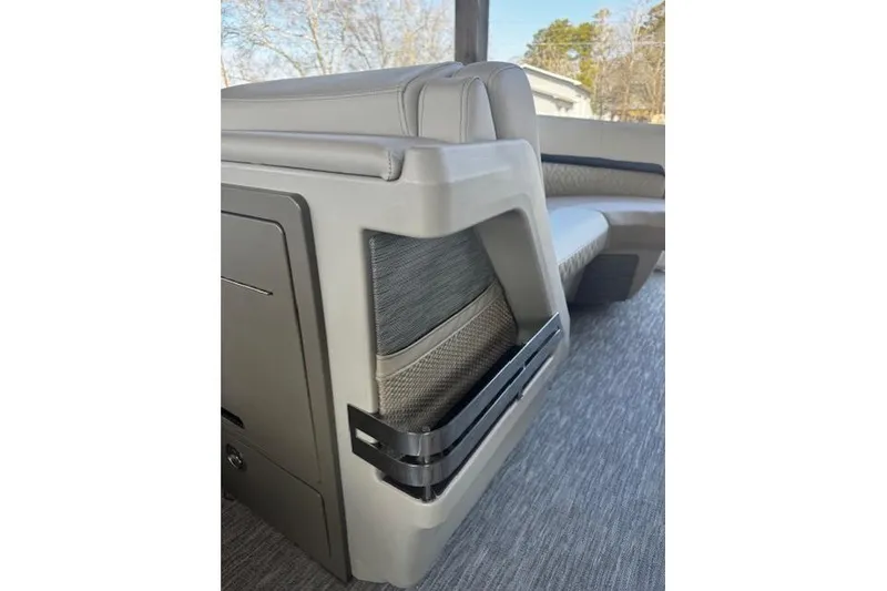 Slide: The Image of 2026 Bennington 22 MFB boat interior with sleek seating and storage compartment. - 11