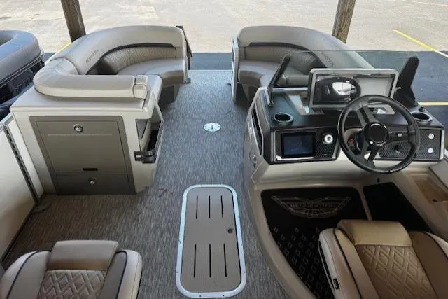 Slide: The Image of Interior of a 2026 Bennington 22 MFB boat with luxurious seating and modern dashboard. - 16