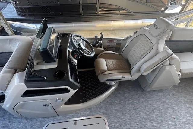 Slide: The Image of 2026 Bennington 22 MFB boat interior with modern helm and luxurious seating. - 5