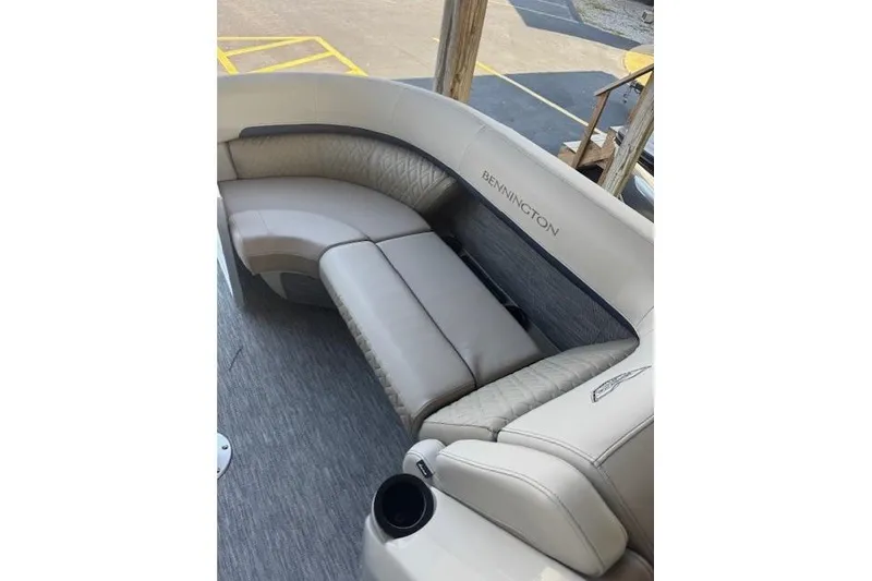 Slide: The Image of Luxurious seating on 2026 Bennington 22 MFB pontoon boat, featuring elegant upholstery and cup holder. - 6