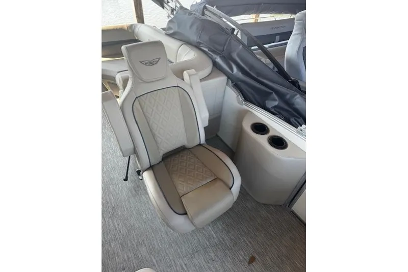 Slide: The Image of Luxury seating on 2026 Bennington 22 MFB boat with cup holders and elegant design. - 8