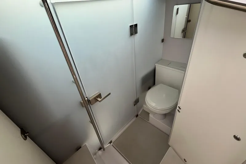 Slide: The Image of 2024 Axopar 37 XC Cross Cabin bathroom with modern fixtures and sleek design. - 17
