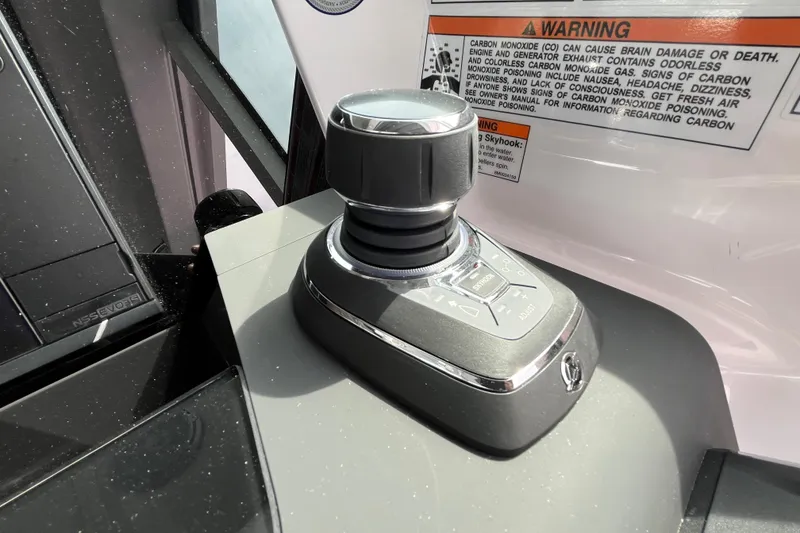 Slide: The Image of Joystick control on 2024 Axopar 37 XC Cross Cabin boat dashboard. - 21