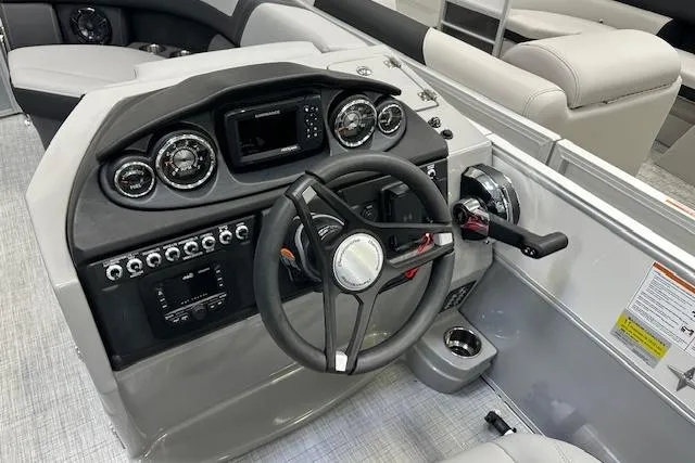Slide: The Image of Cockpit of 2025 Berkshire 22RFX CTS boat with modern steering and controls. - 10