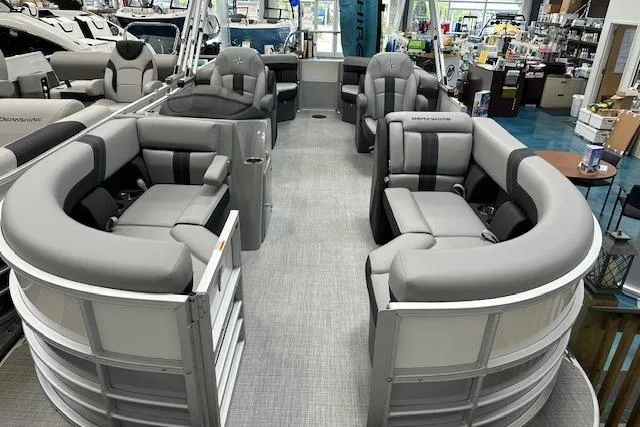 Slide: The Image of 2025 Berkshire 22RFX CTS pontoon boat with luxurious gray seating in showroom. - 15