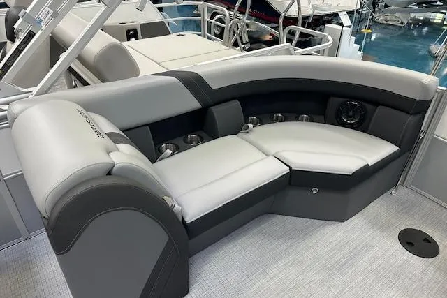 Slide: The Image of 2025 Berkshire 22RFX CTS boat interior with luxurious gray seating and cup holders. - 3