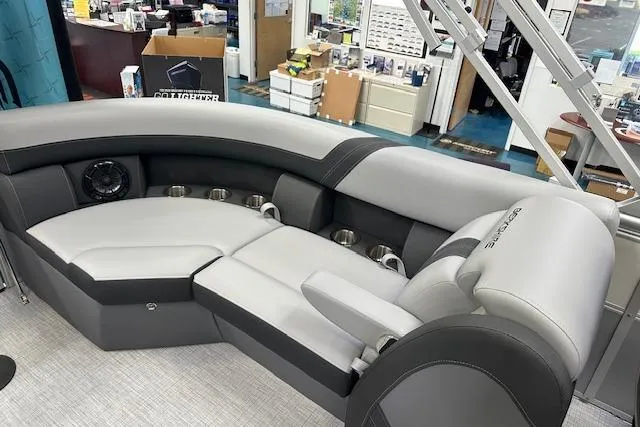 Slide: The Image of Luxurious seating on 2025 Berkshire 22RFX CTS pontoon boat, featuring cup holders and speaker. - 4