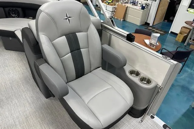 Slide: The Image of Luxurious captain's chair in 2025 Berkshire 22RFX CTS boat, featuring cup holders and sleek design. - 6