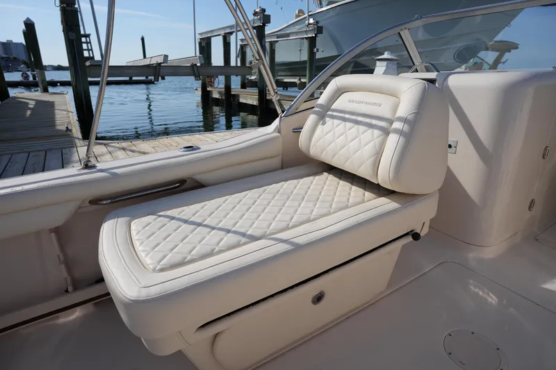 Slide: The Image of Luxurious seating on a 2021 Grady-White Freedom 215 boat at a dockside location. - 21
