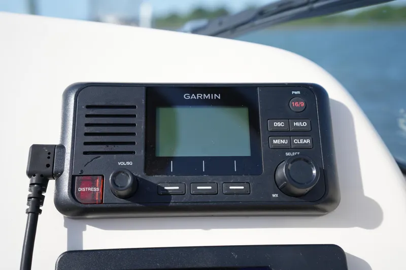 Slide: The Image of Garmin marine radio on 2021 Grady-White Freedom 215 boat dashboard. - 27