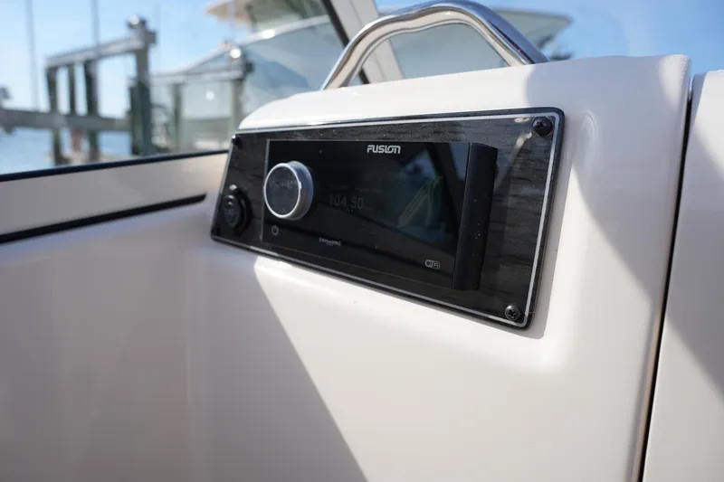 Slide: The Image of Fusion stereo system on 2021 Grady-White Freedom 215 boat dashboard. - 34