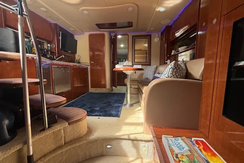 Slide: The Image of Luxurious interior of 2004 Sea Ray 390 Sundancer yacht with elegant seating and modern amenities. - 10