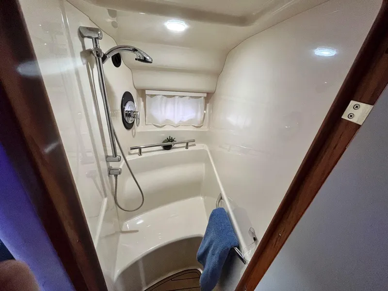 Slide: The Image of Sea Ray 390 Sundancer 2004 bathroom with shower and window. - 15