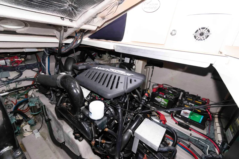 Slide: The Image of Engine room of a 2004 Sea Ray 390 Sundancer with Mercury engine and batteries. - 17