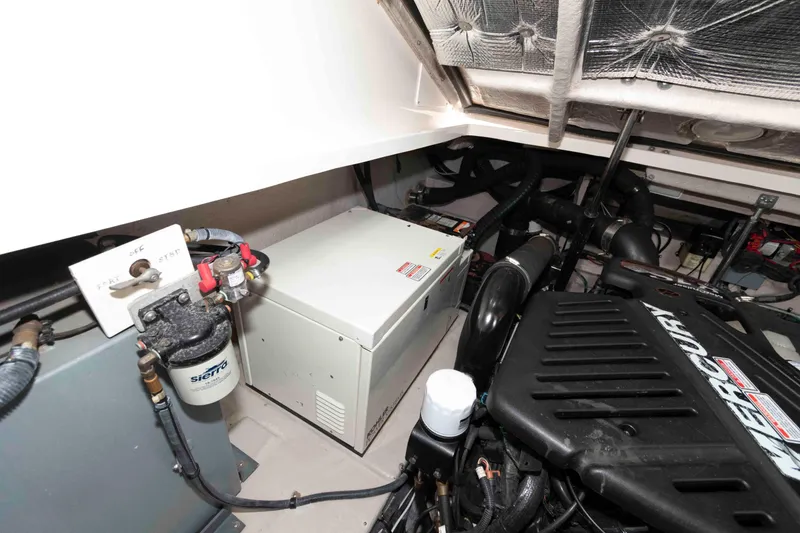 Slide: The Image of Engine room of 2004 Sea Ray 390 Sundancer with Mercury components and Sierra filter. - 19