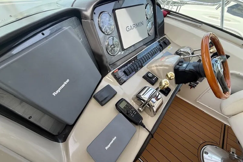Slide: The Image of Helm of 2004 Sea Ray 390 Sundancer with Garmin and Raymarine navigation systems. - 7