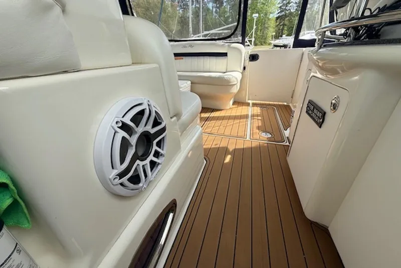 Slide: The Image of 2004 Sea Ray 390 Sundancer interior with wood flooring and seating area. - 9