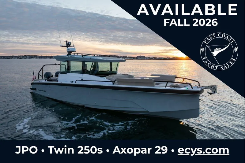 The Image of Axopar 29 XC Cross Cabin 2027, available fall 2026, showcased on calm waters at sunset. - 0