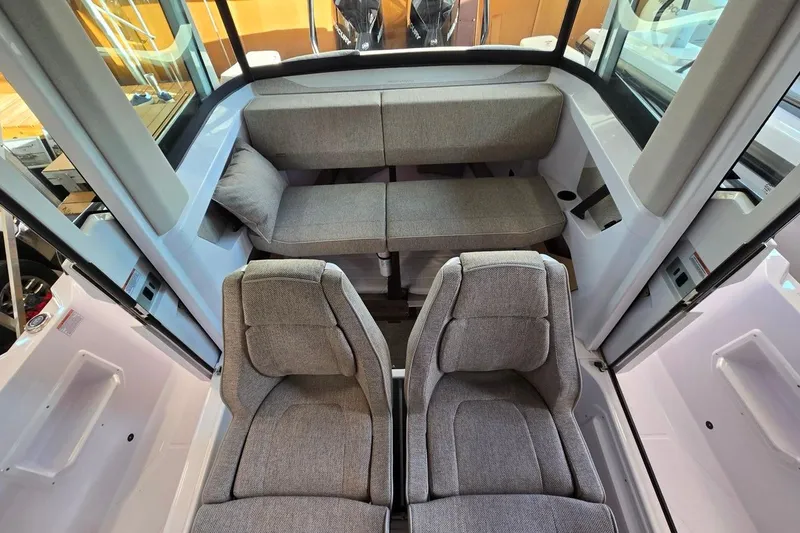 Slide: The Image of 2026 Axopar 29 XC Cross Cabin interior with modern seating and sleek design. - 13