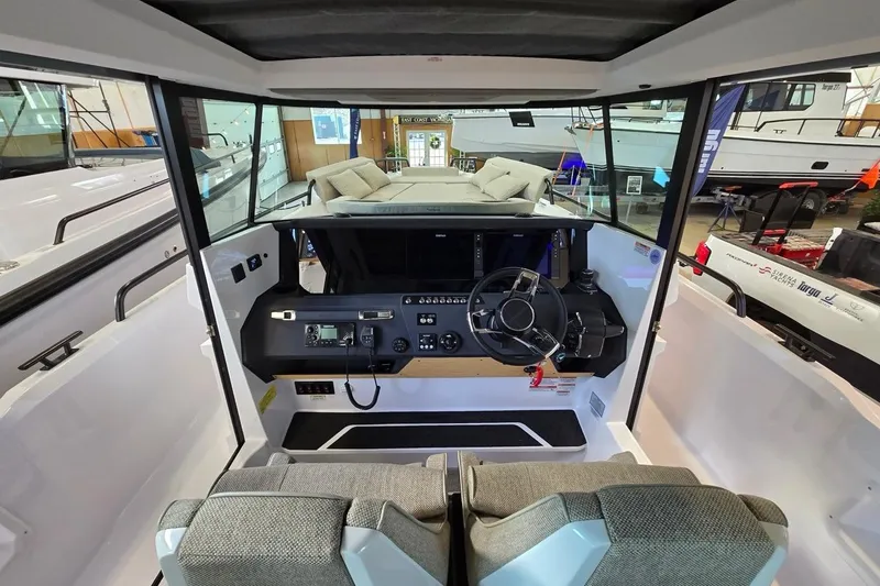 Slide: The Image of 2026 Axopar 29 XC Cross Cabin interior with modern dashboard and seating. - 17