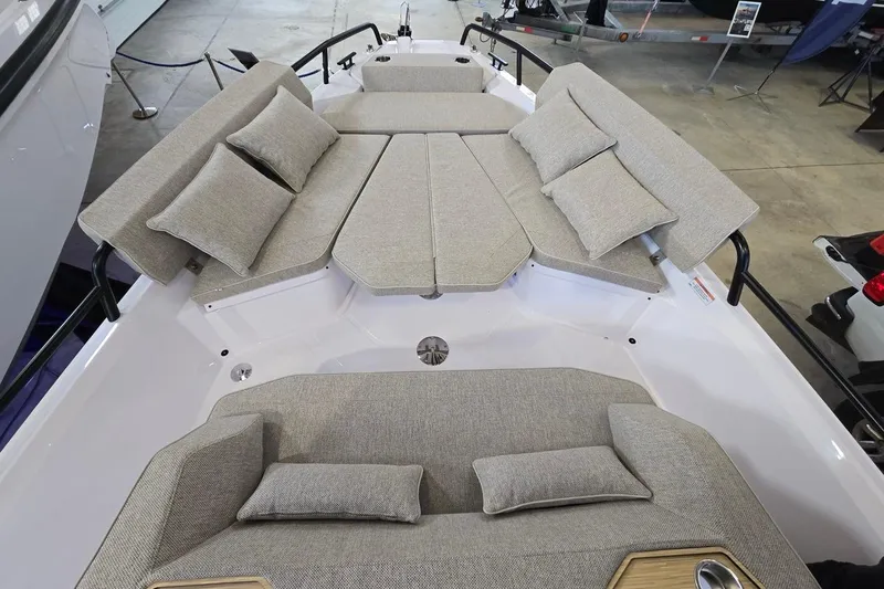 Slide: The Image of 2026 Axopar 29 XC Cross Cabin with spacious cushioned seating and modern design. - 18
